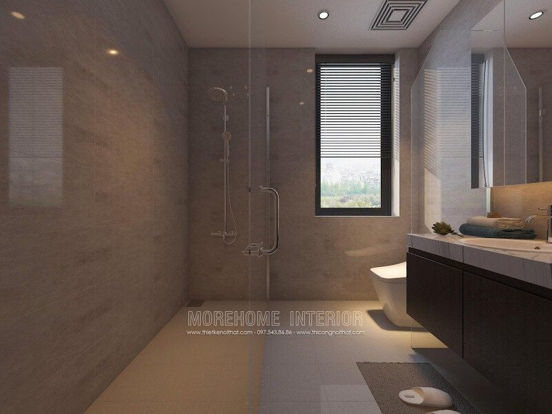 Bố trí nội thất phòng tắm nhỏ đẹp sang trọng với vách tắm kính 135 độ song song với không gian vệ sinh từ tủ, gương và bồn cầu.